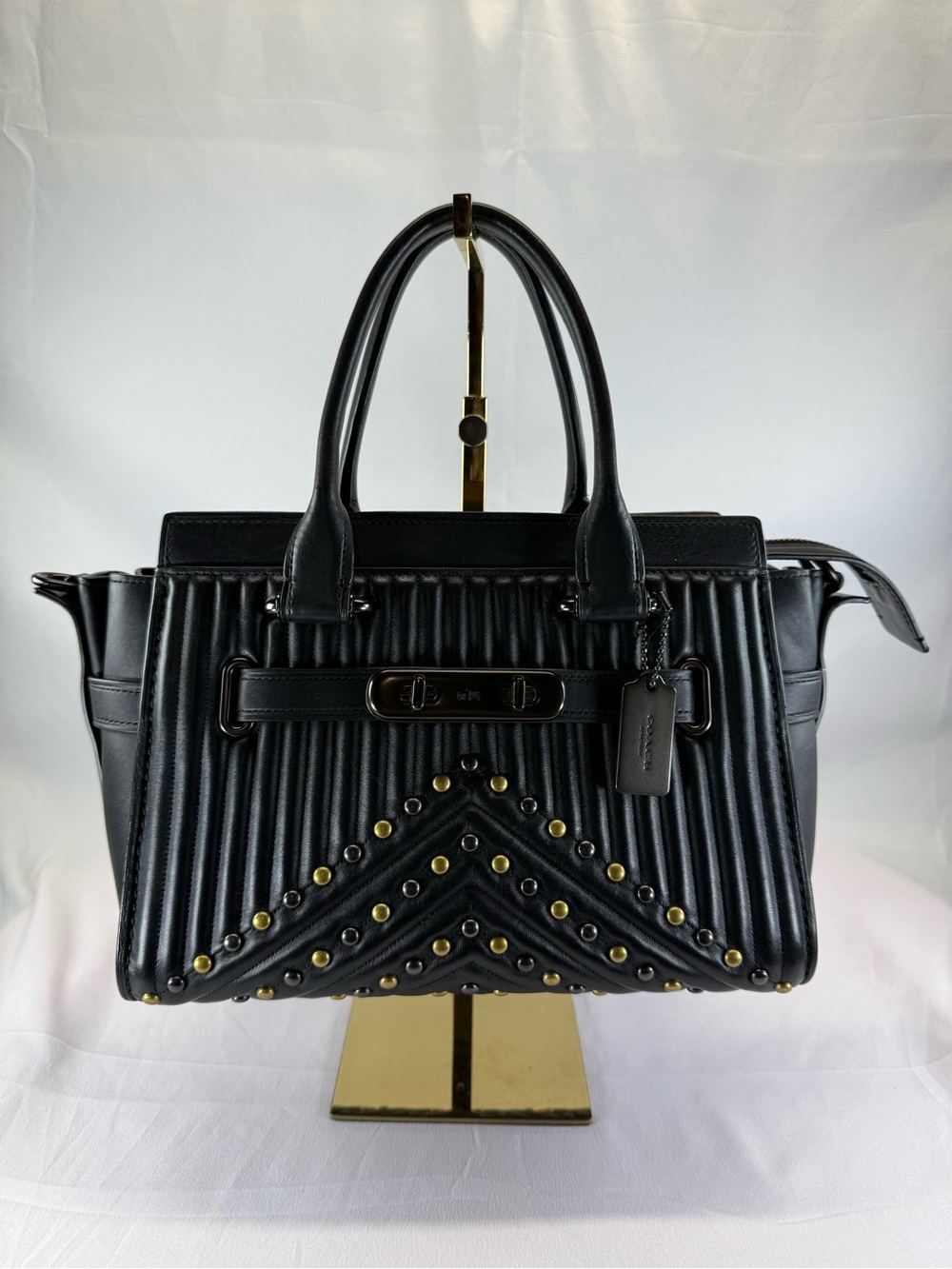 Coach Swagger 27
With Quilting And Rivets Handbag